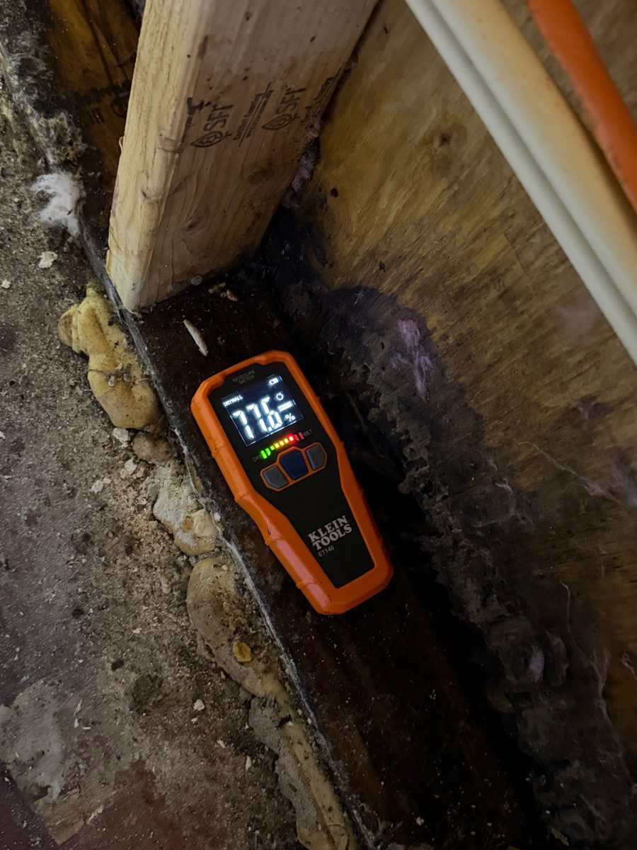 Moisture meter reading inside a wall cavity